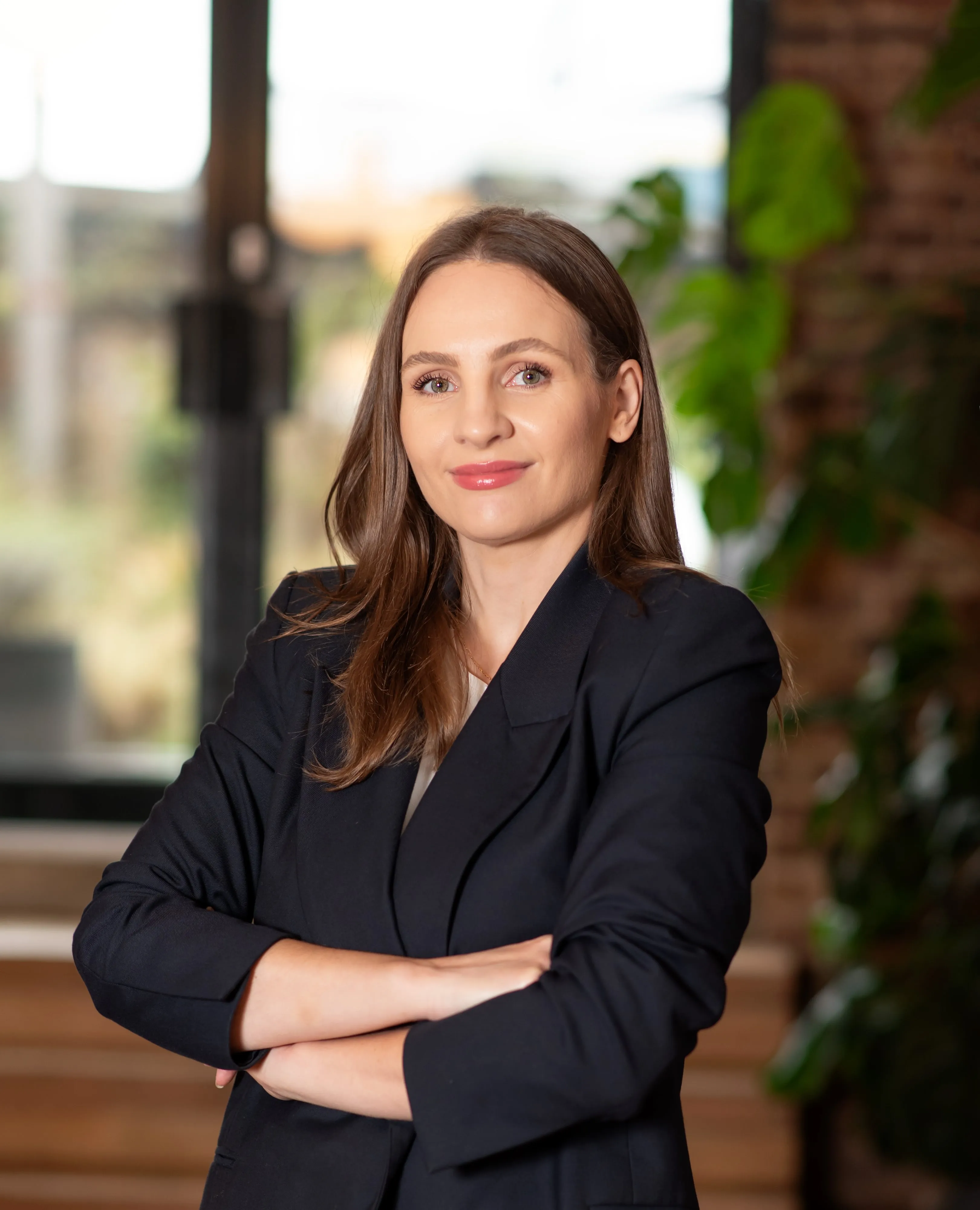 Woman in navy blazer professional headshot