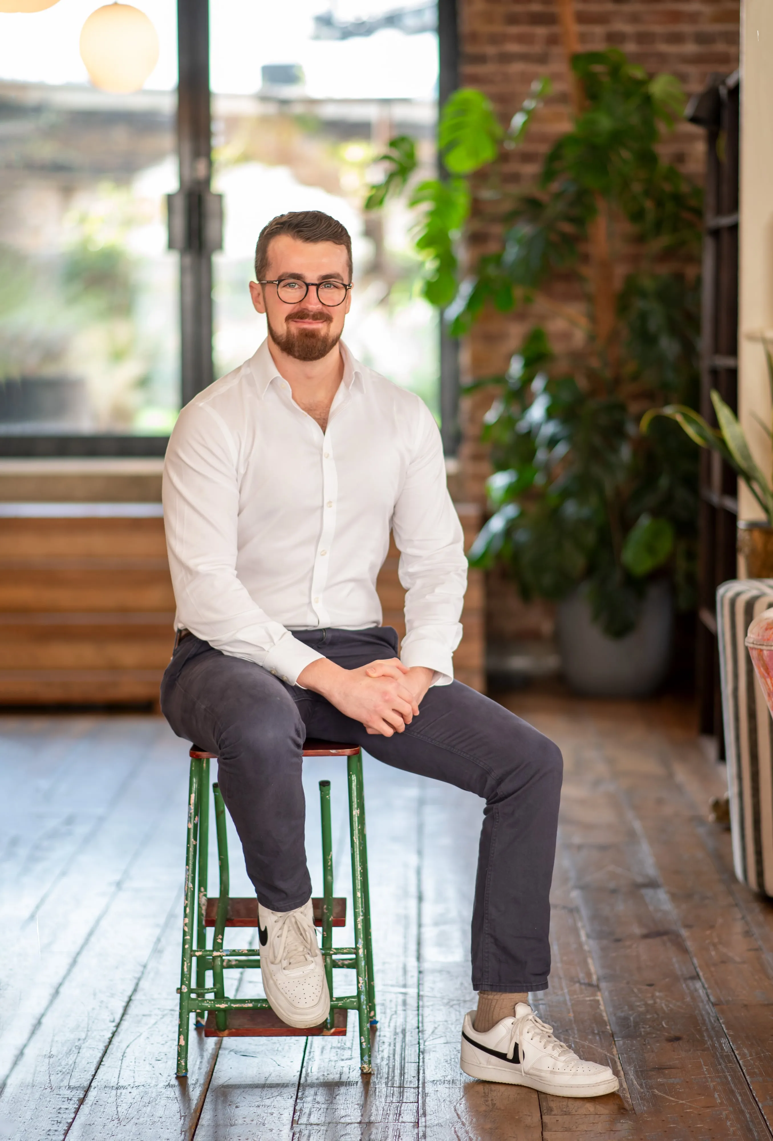 Confident professional headshot in office environment