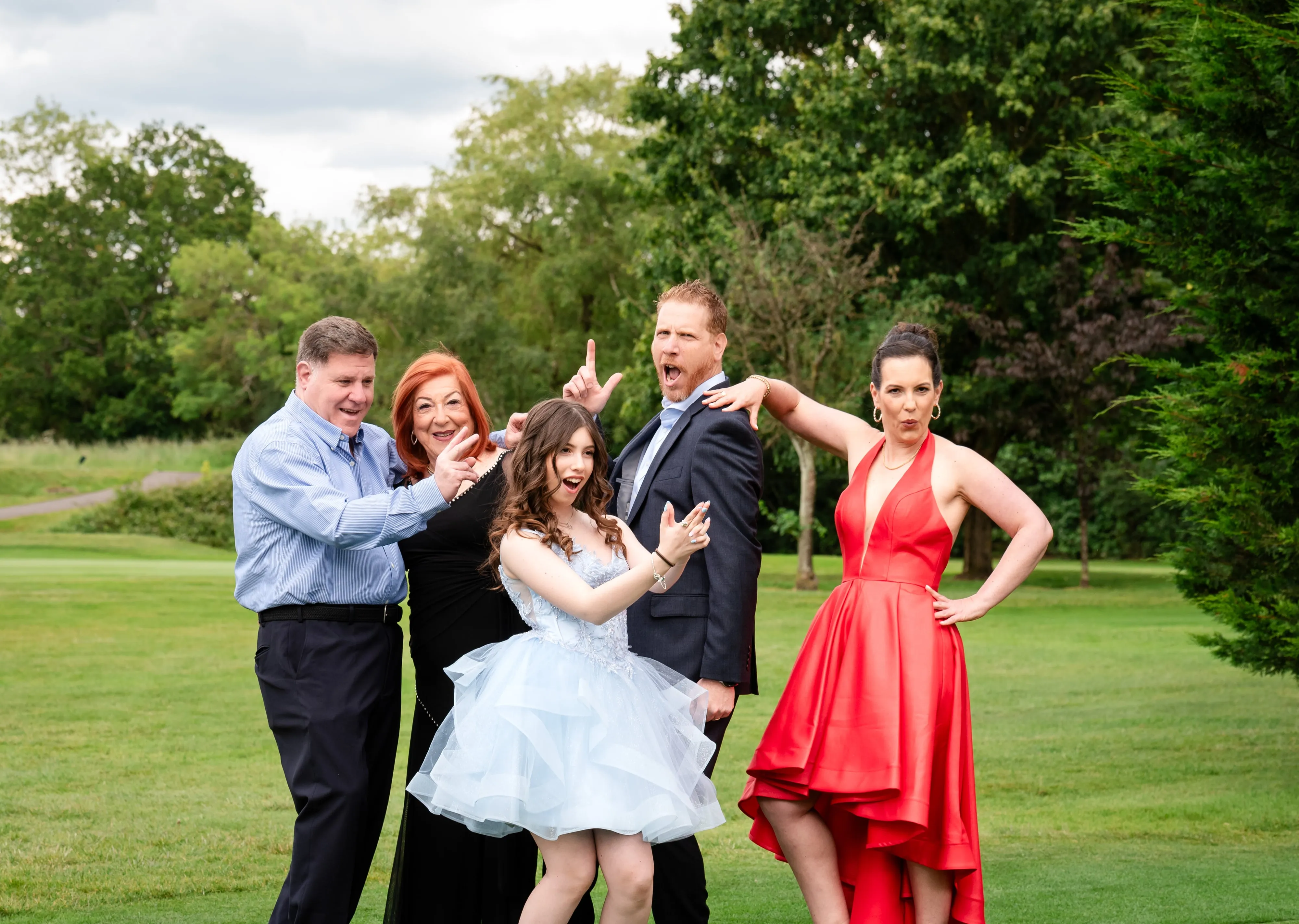 Family pose silly for bar/bat mitzvah celebration in London