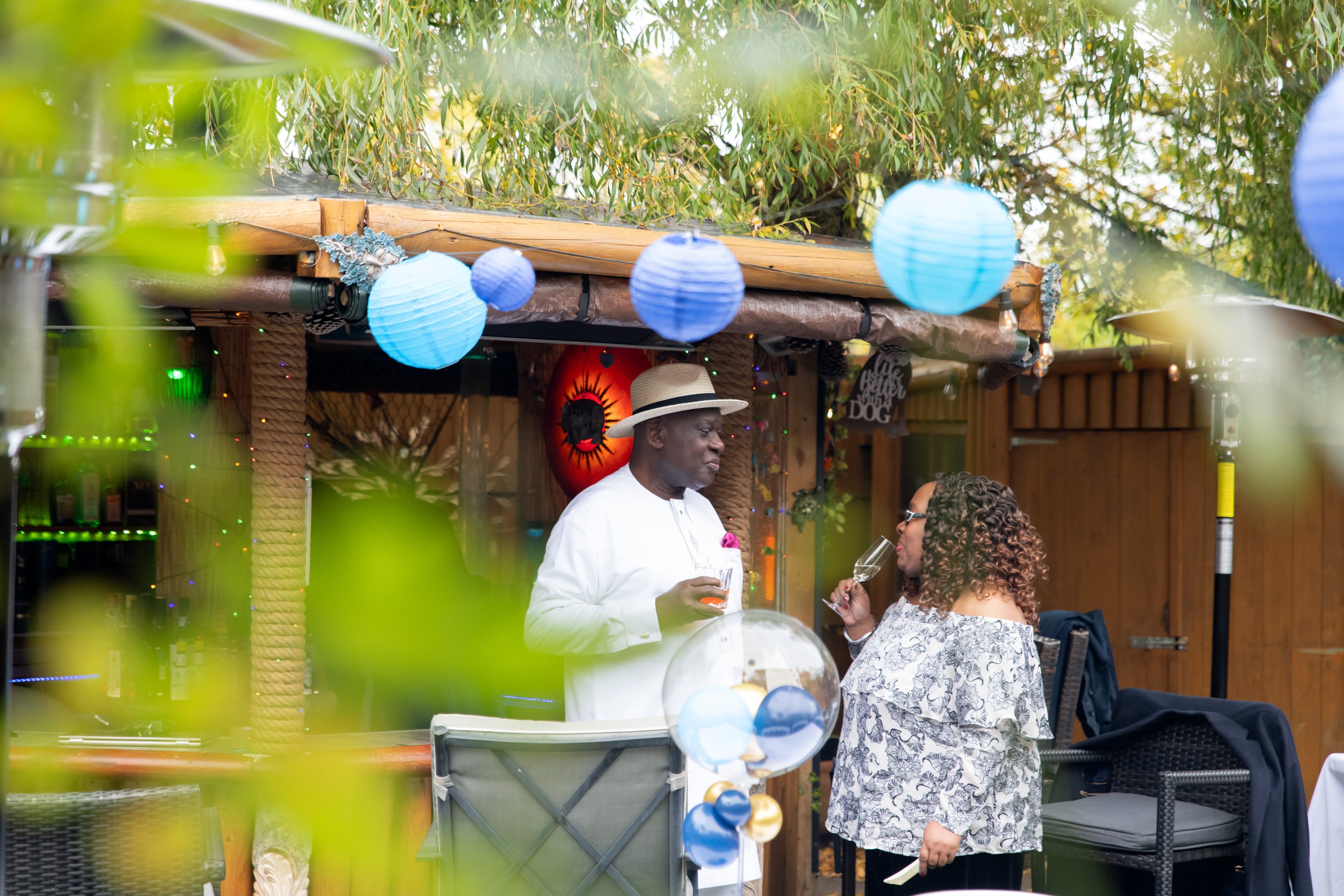 Tray of champagne flutes poured and waiting at the garden party bar
