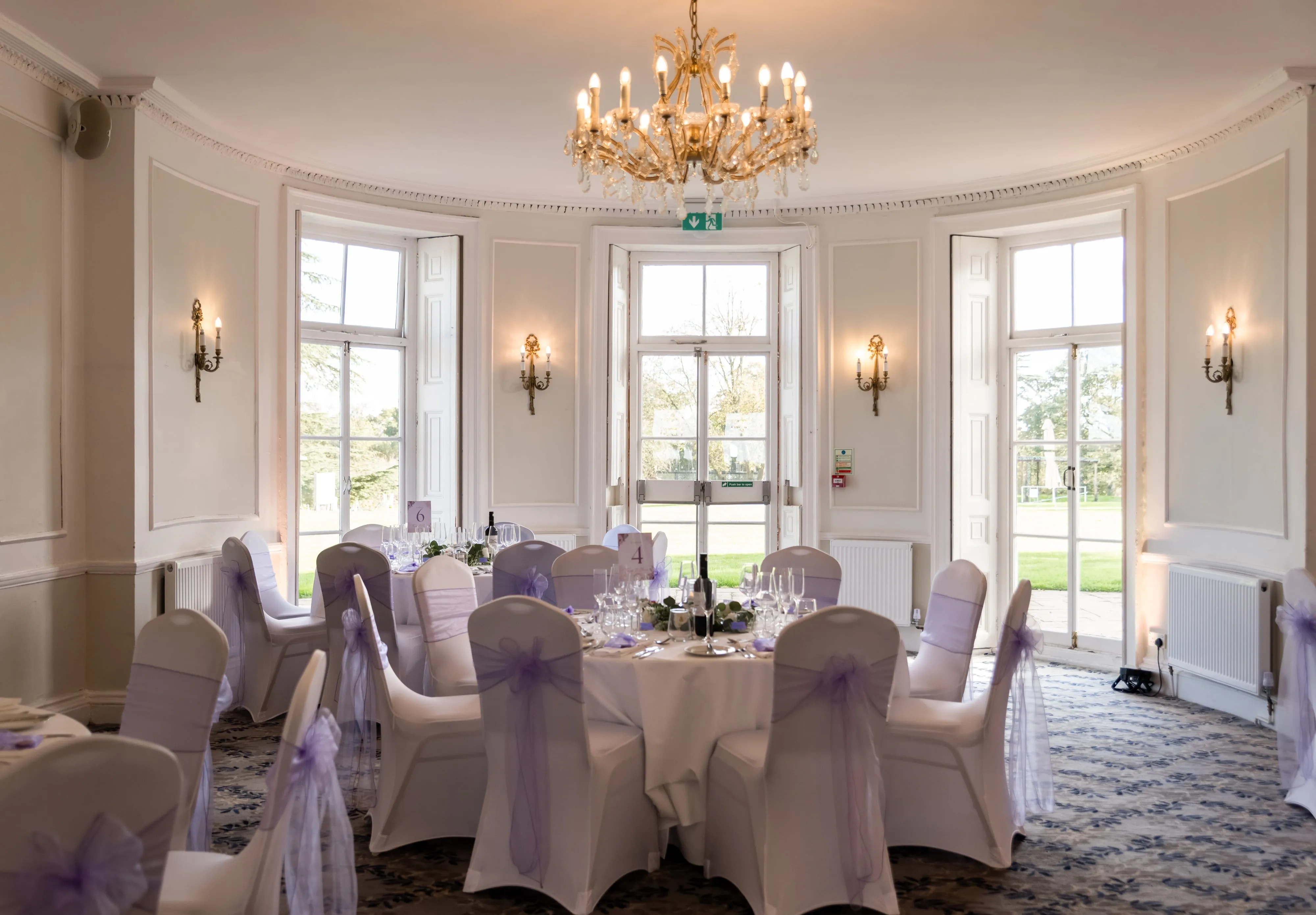 Reception room set for wedding breakfast at Dyrham Park