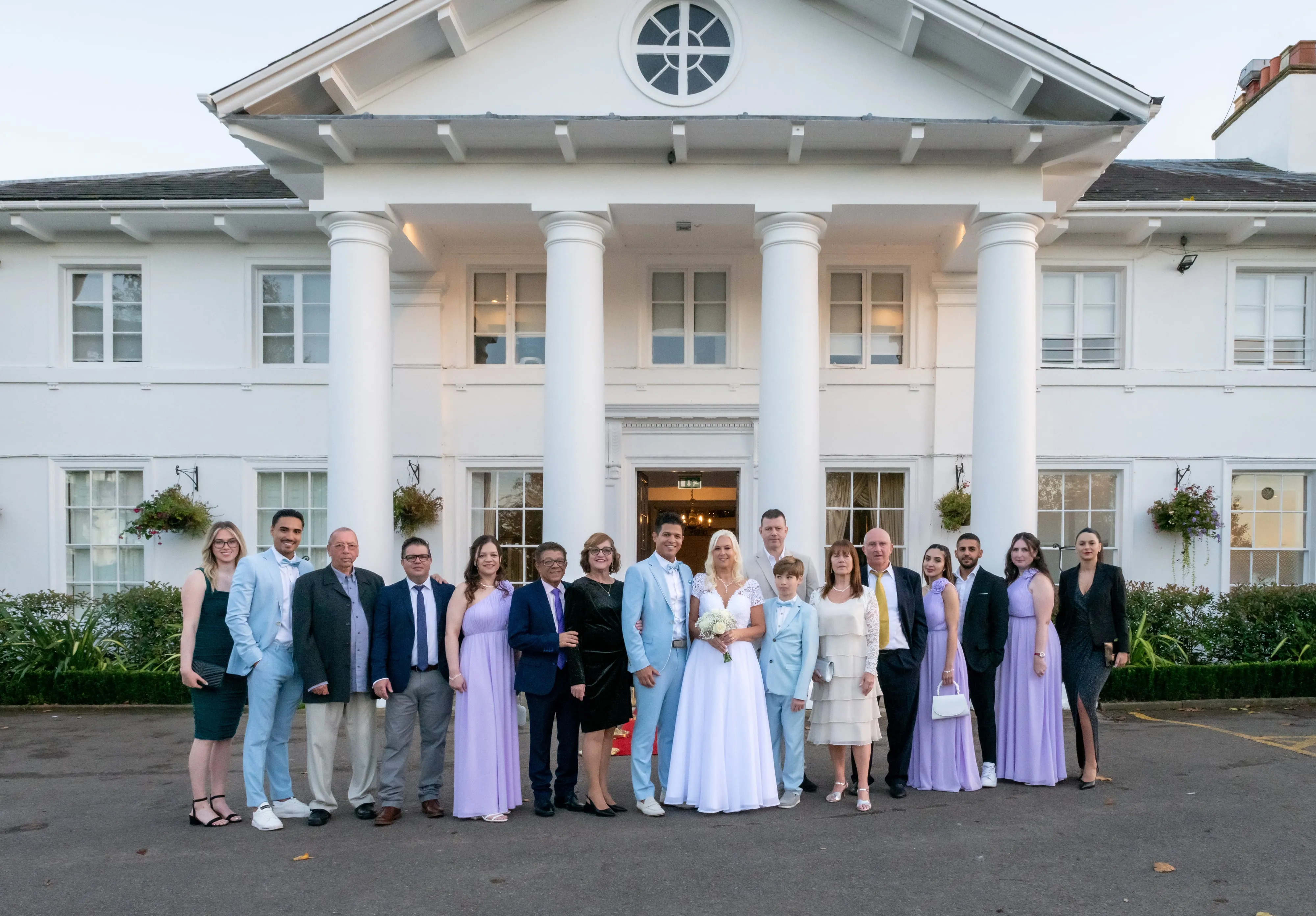 Group portrait of wedding party on Dyrham Park steps