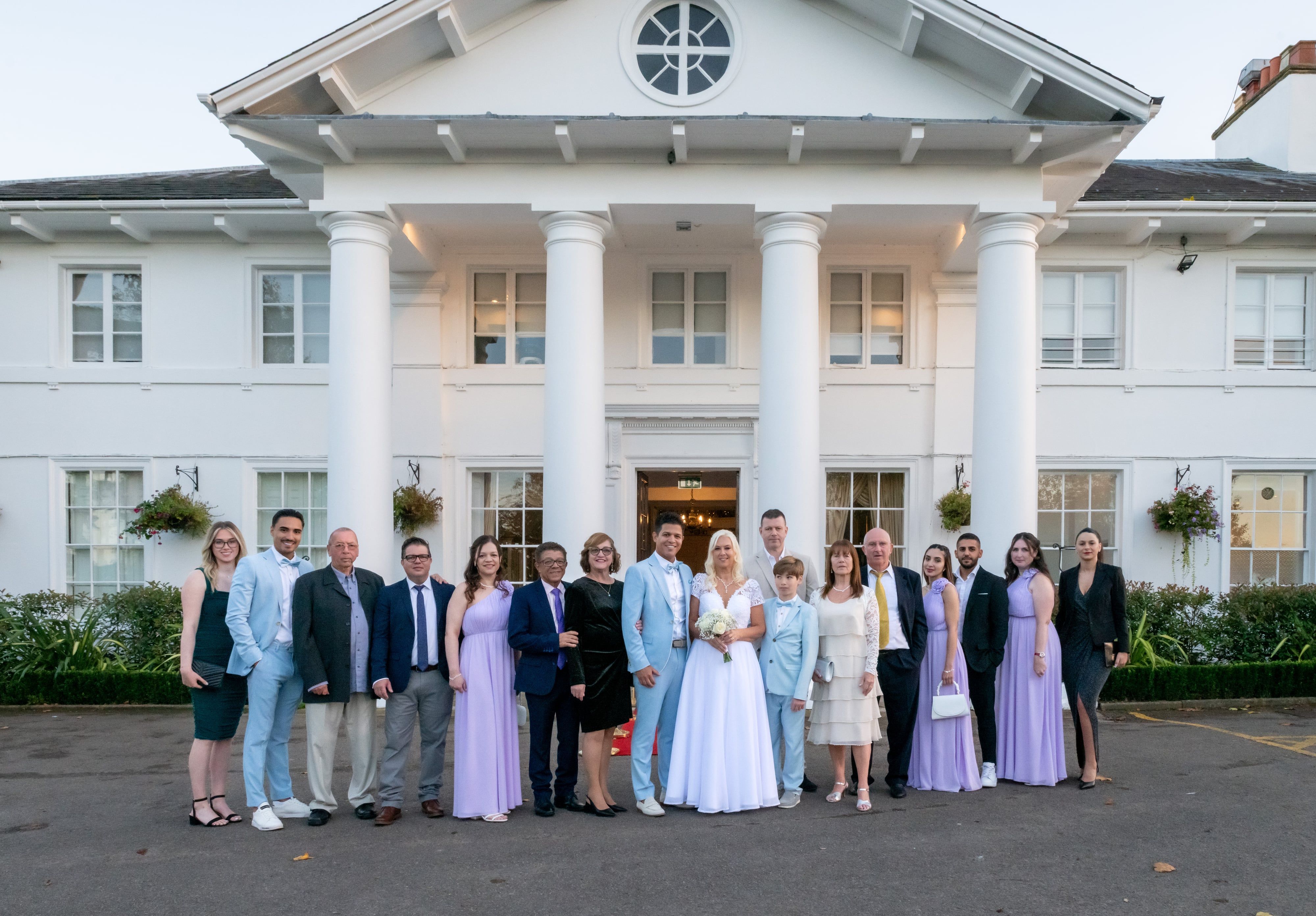 Group portrait of wedding party on Dyrham Park steps