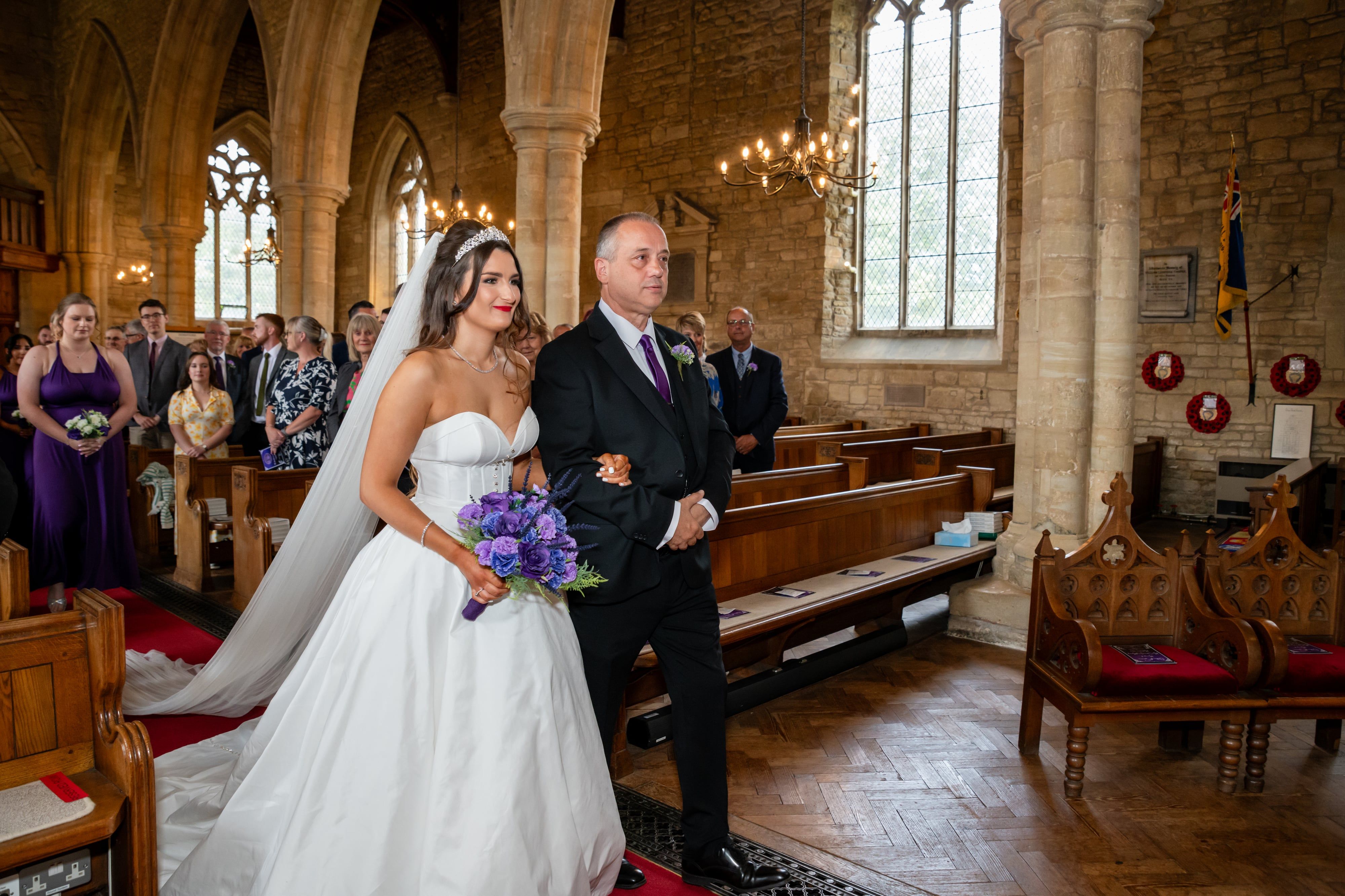 Bride and her father pause at the head of the aisle